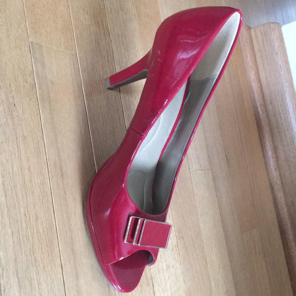Flirty red peep toe pumps
